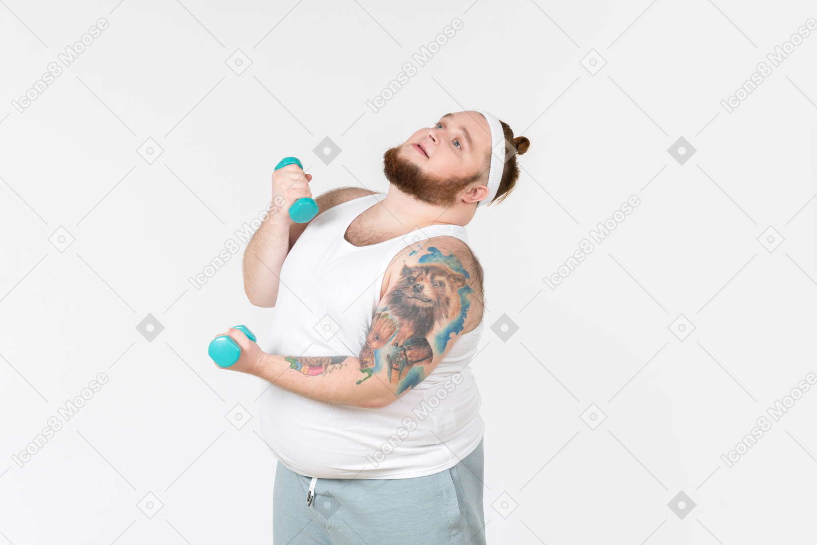 Dreamy big guy in sportswear lifting hand weights