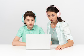 Happy mother and son listening to some musis together