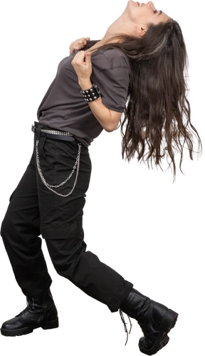 Side view of a female rocker tearing up her t-shirt while throwing head back