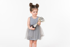 Little girl holding an award cup