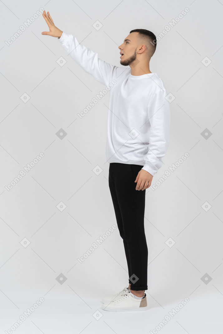 Young man raising arm