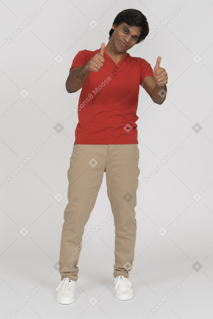 Young man showing two thumbs up