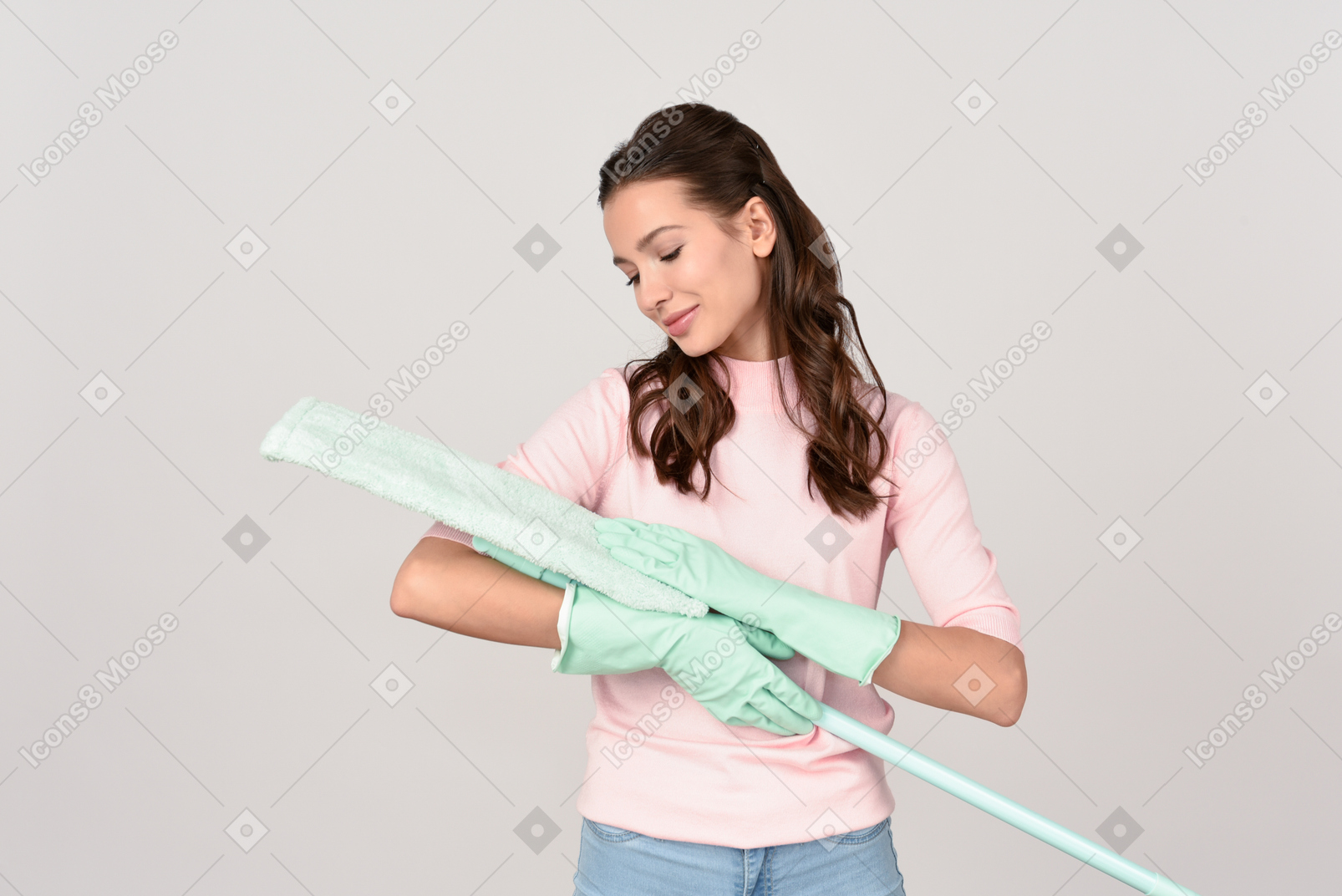 Attractive young woman gently stroking a mop pad