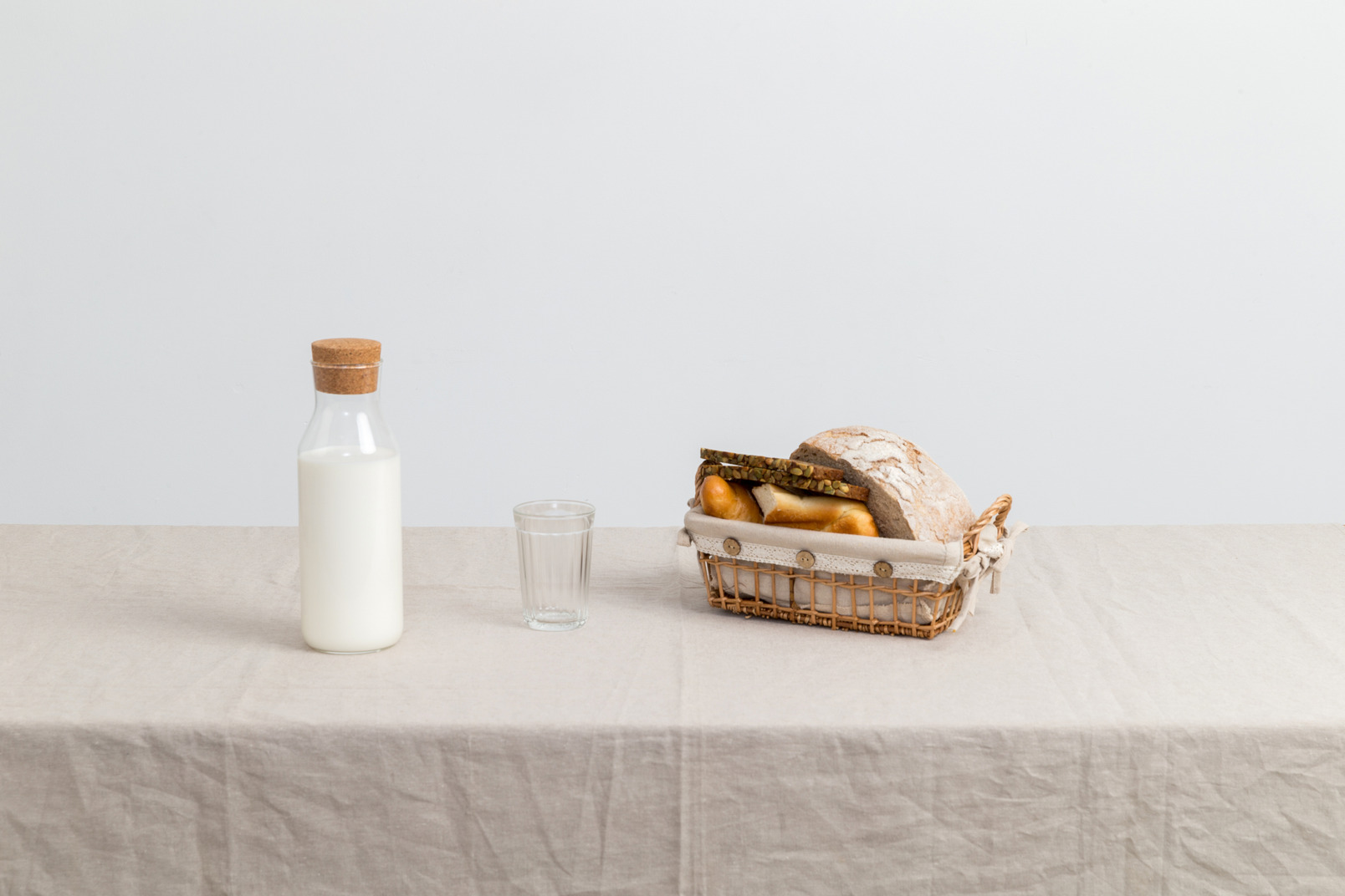 Bottle of milk, empty of glass of milk and bread