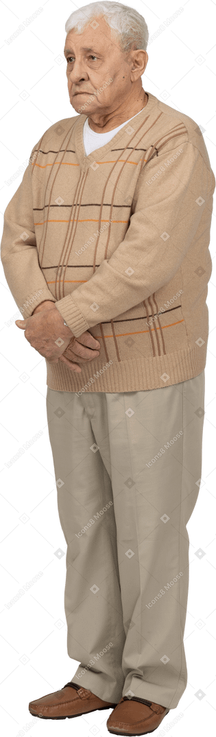 Front view of an old man in casual clothes standing still