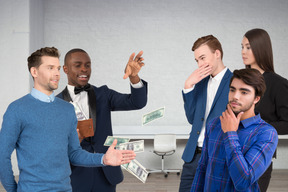 A group of people standing around each other