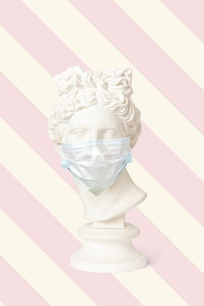 Statue bust in medical mask