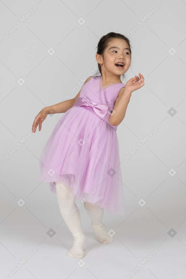 Girl in a pink dress fooling around