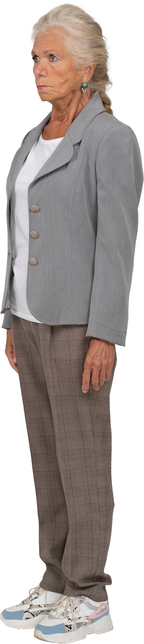 Side view of a serious old lady in suit