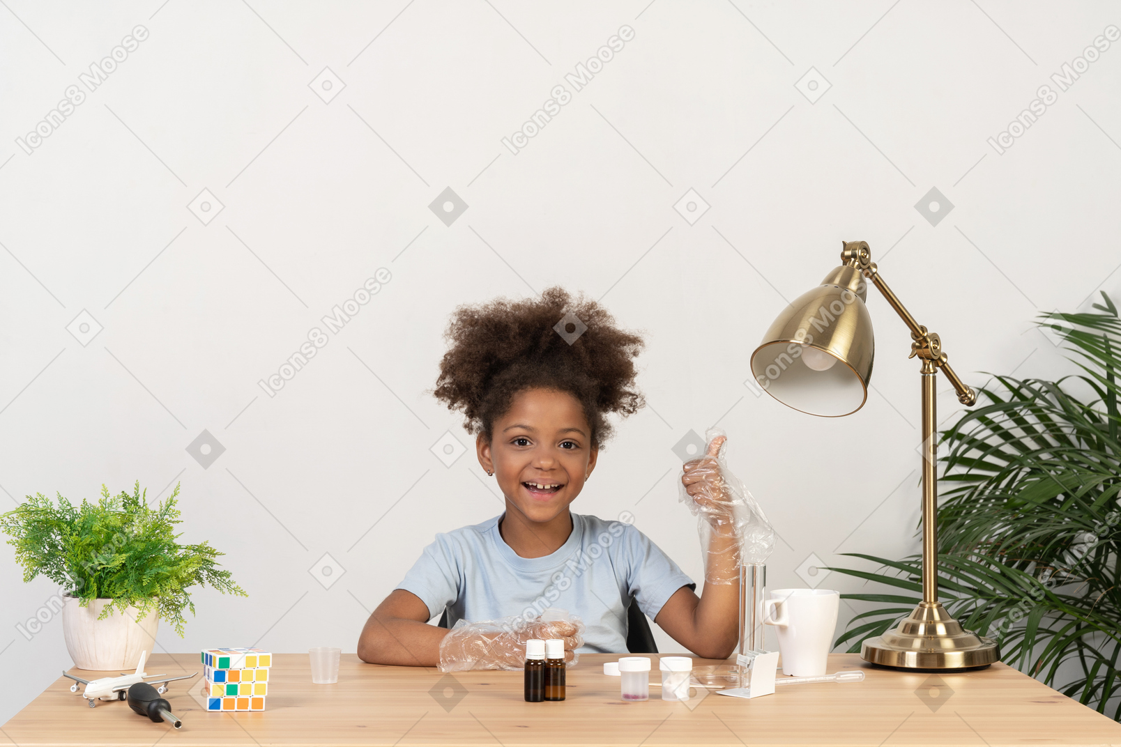 Good looking cute girl doing science at the table