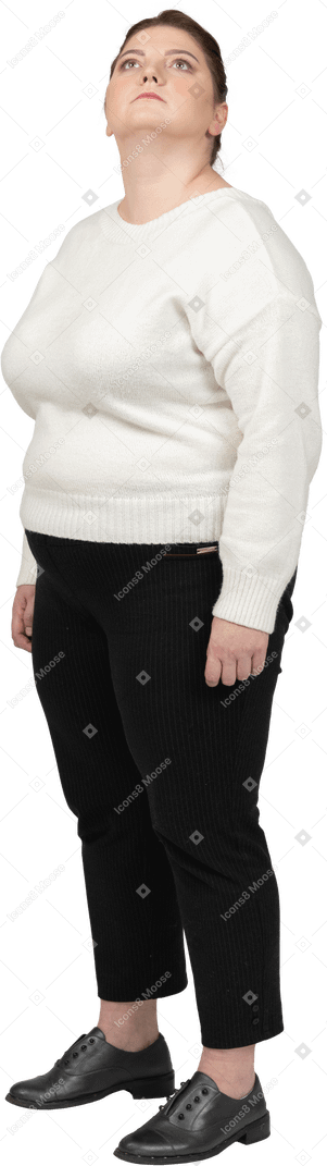 Plump woman in casual clothes standing