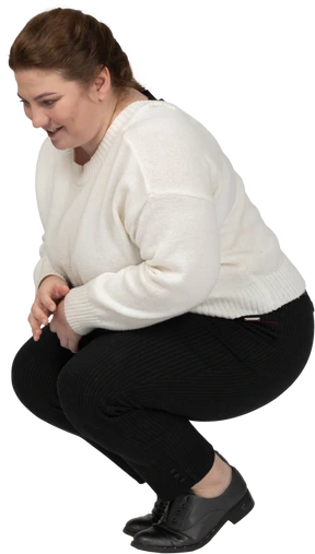 Side view of a plus size woman in casual clothes squatting