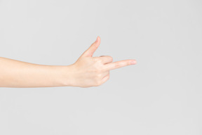 Side look of female hand showing middle finger