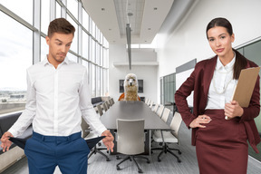 A man and a woman standing in an office