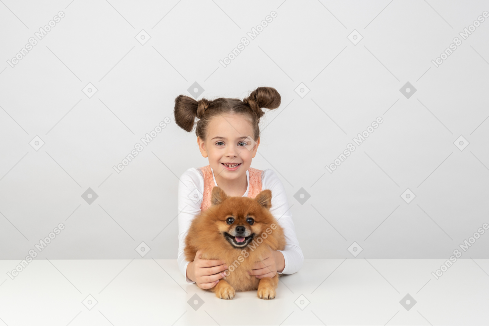 Kid girl holding a spitz