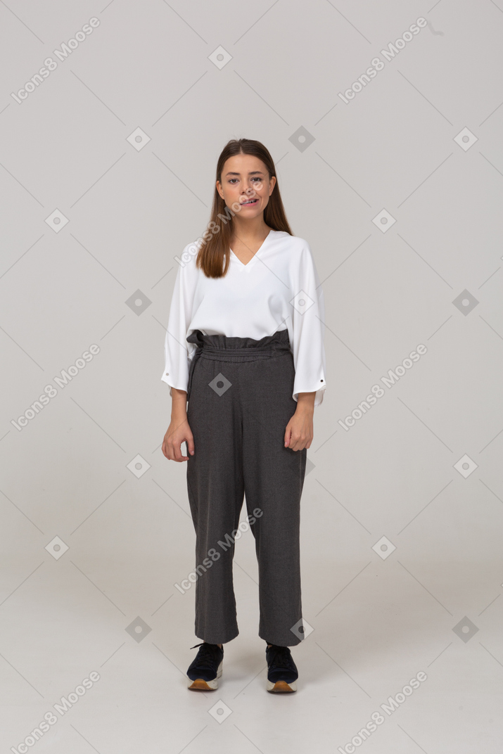 Front view of an arrogant young lady in office clothing