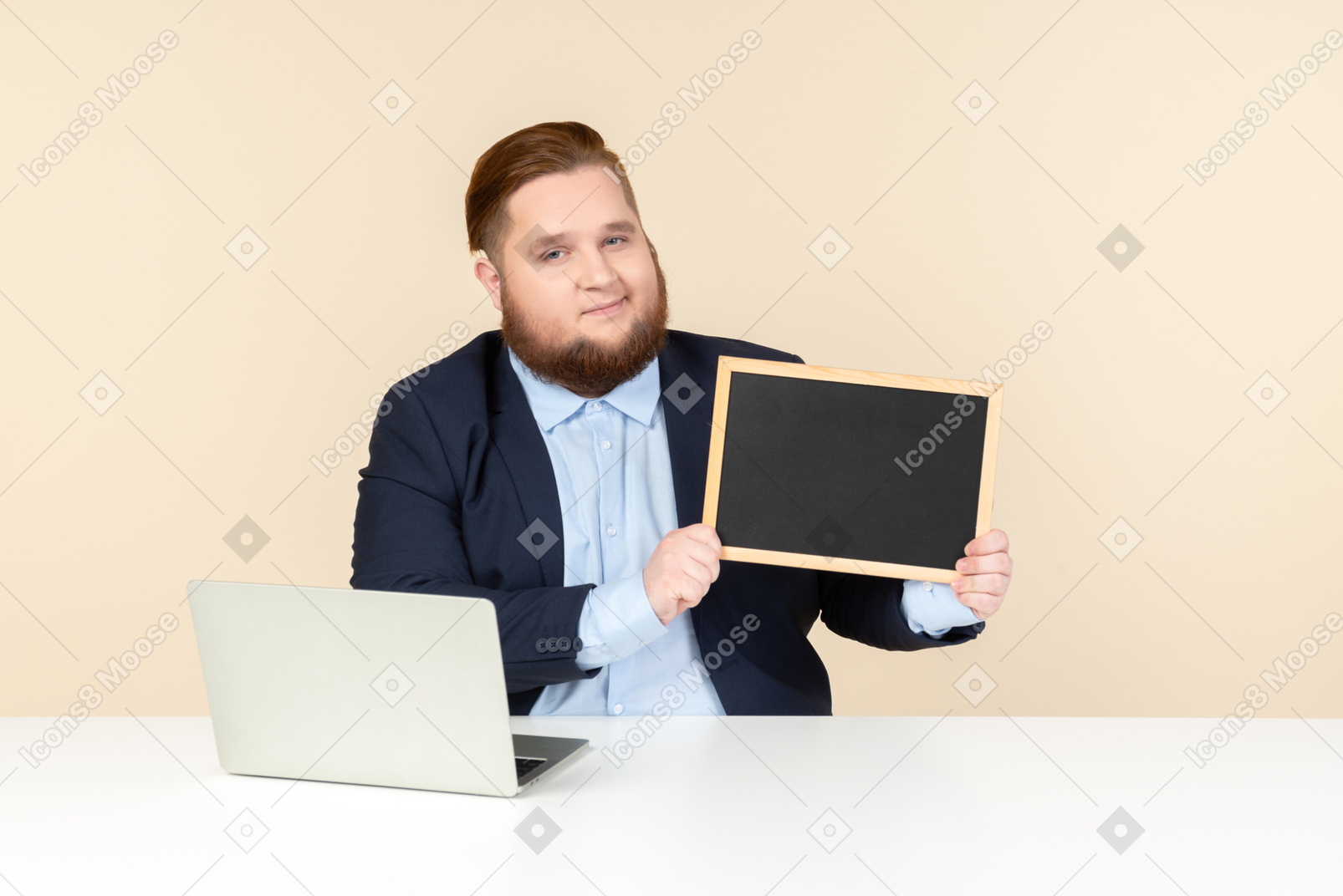 Man in a suit with a laptop