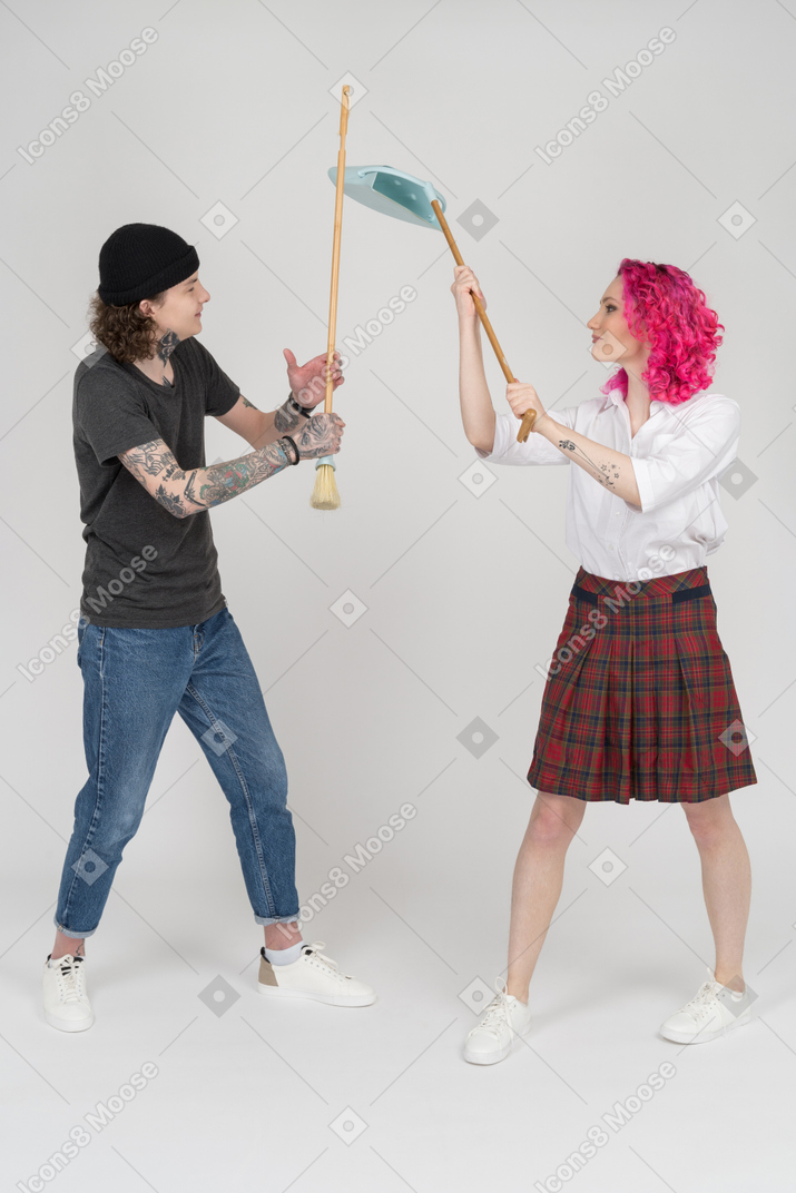 Teenage couple on a duel during the cleaning