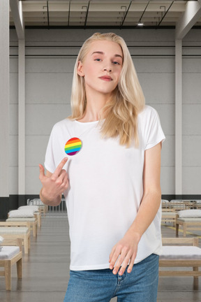 Woman pointing at lgbt badge on her t-shirt