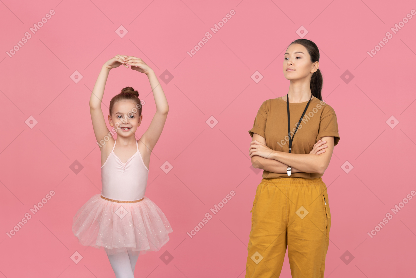 Dance teacher looking proudly at her little apprentice