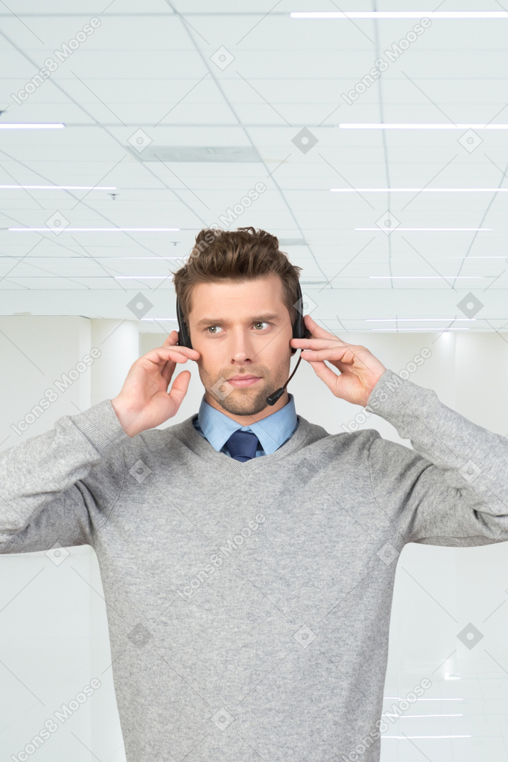 A man wearing a headset in an office