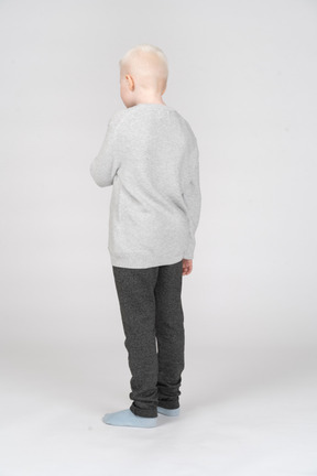 Back view of a boy in casual clothes