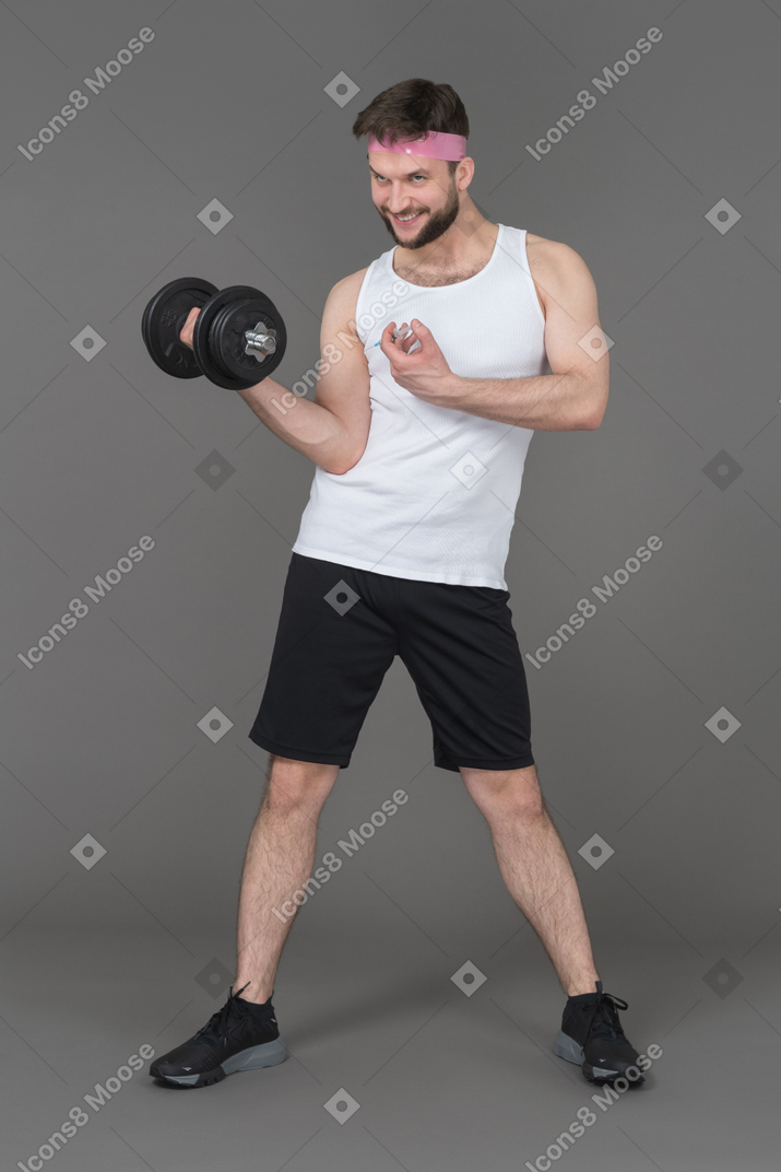 A smiling young man working out