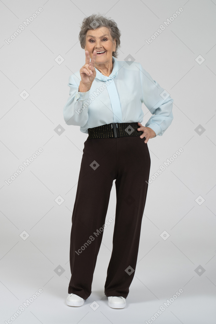 Old lady giving peace sign