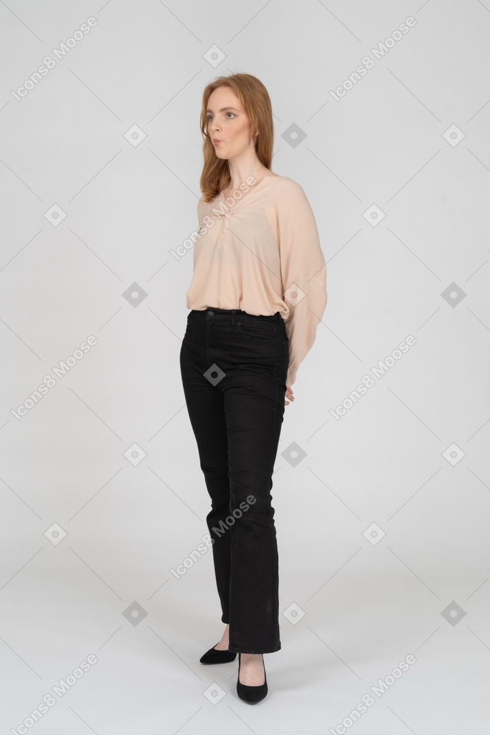 Woman in beautiful blouse standing