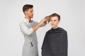 A young barber and his client