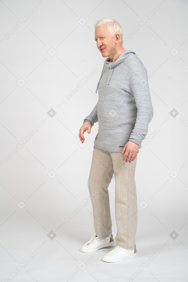 Grinning middle-aged man walking