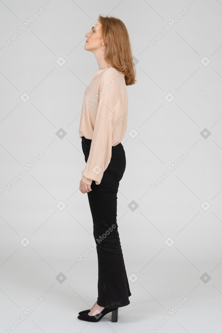 Side view of young woman standing