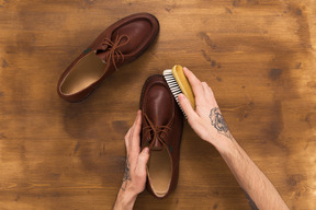 Male leather shoes on wooden background