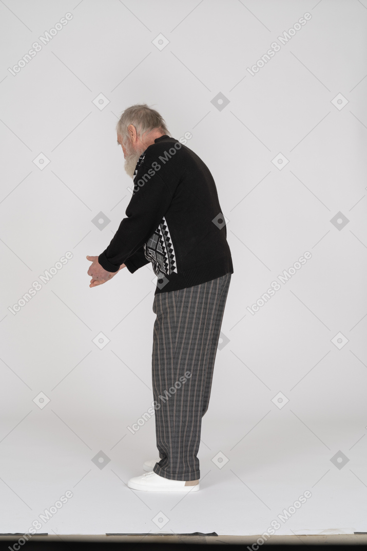 Rear view of old man gesturing