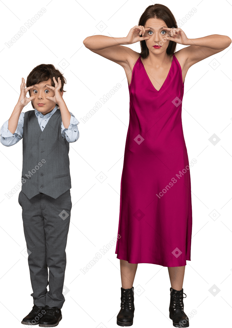 Front view of stylish boy and woman widening their eyes