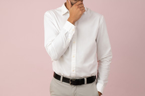 Cropped photo of a young man in a white shirt