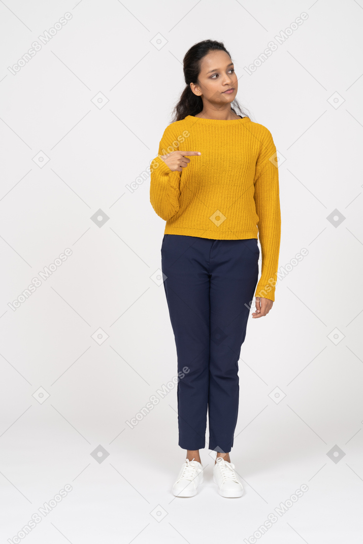 Front view of a girl in casual clothes pointing to herself