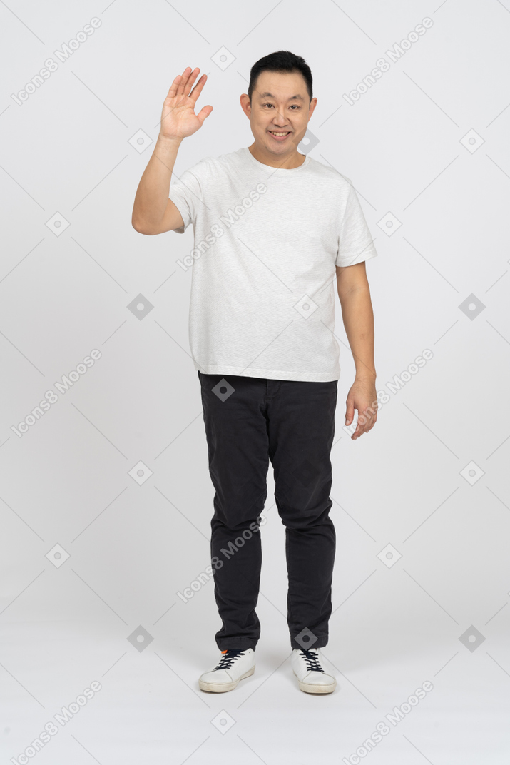 Front view of a happy man waving