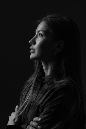 Black and white photo of woman looking up