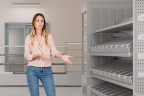 Puzzled woman looking at empty shelves