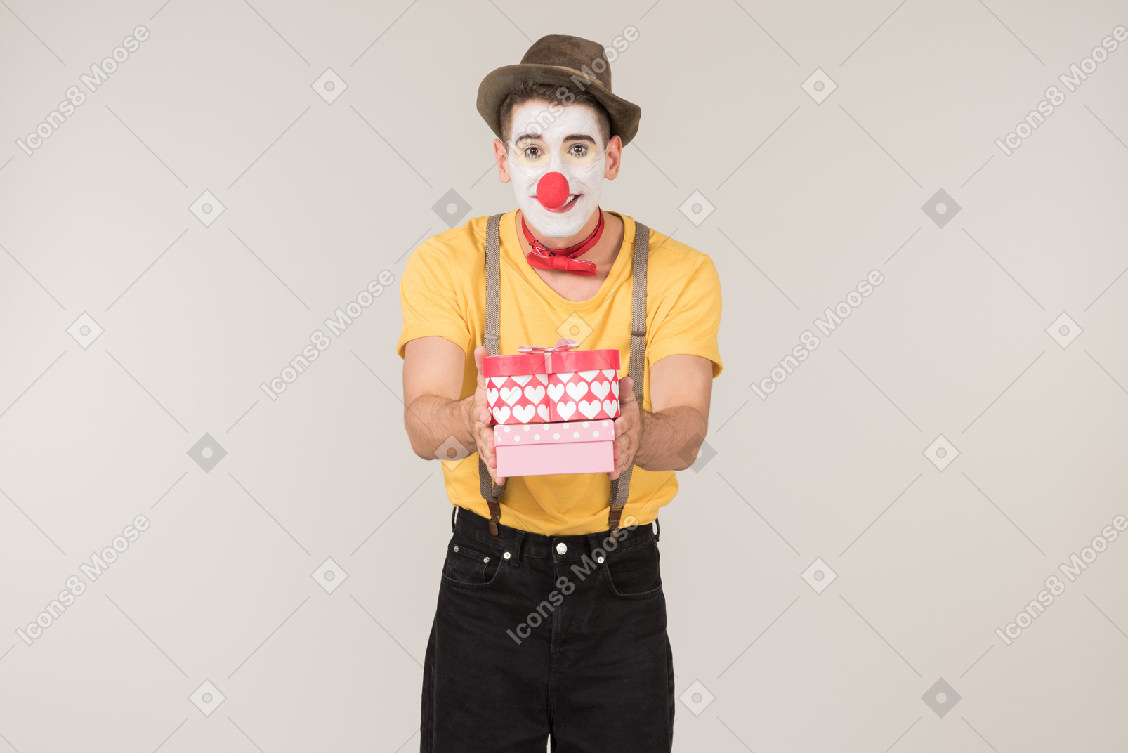 Male clown holding gift box