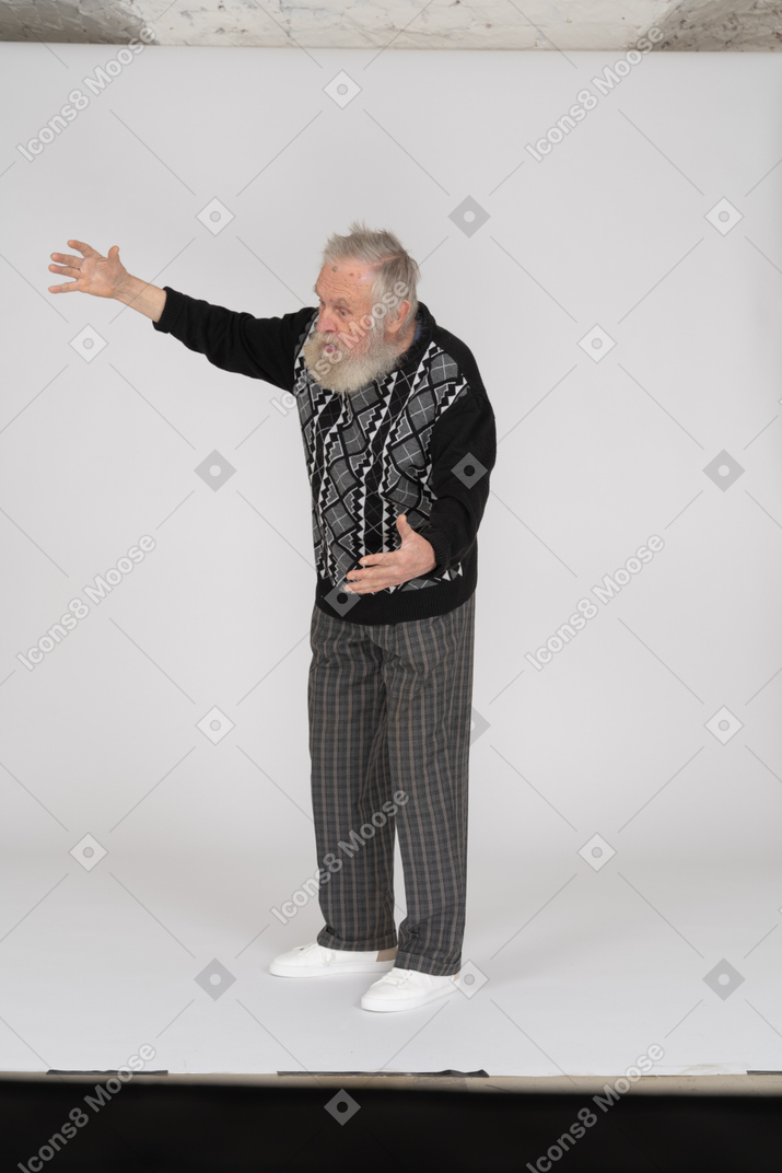 Old man showing something big with hands
