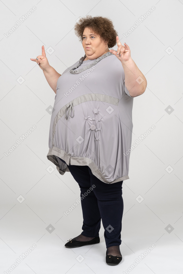 Woman sowing rock and roll hand gesture