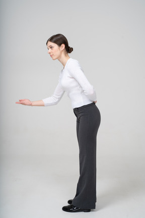 Side view of a woman in suit gesturing
