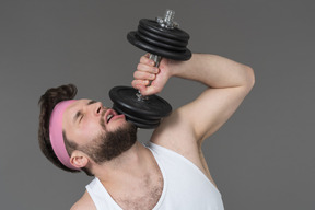 A man lifting weights at the breaking point