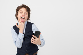 Schoolboy making faces for a selfie