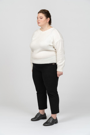 Plump woman in casual clothes standing