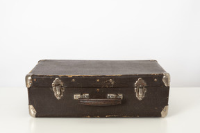 Old suitcase on a white background