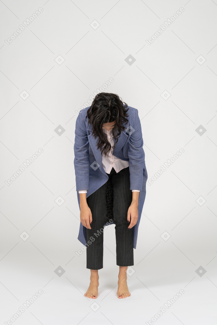 Exhausted woman bending down