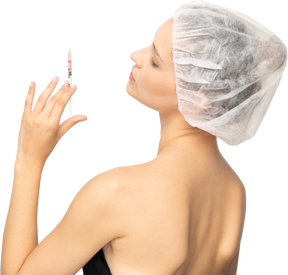 Rear view of a woman with syringe